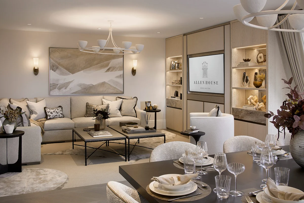 Open-plan living and dining area with integrated shelving, soft furnishings, and layered lighting.