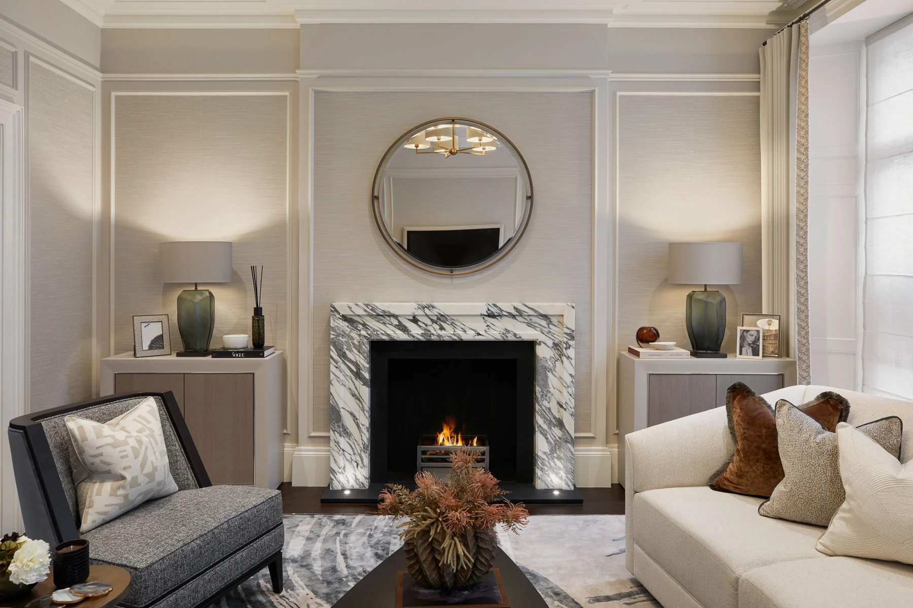 Sophisticated living room with marble fire place in the centre.